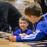 Smiling kids signing the court